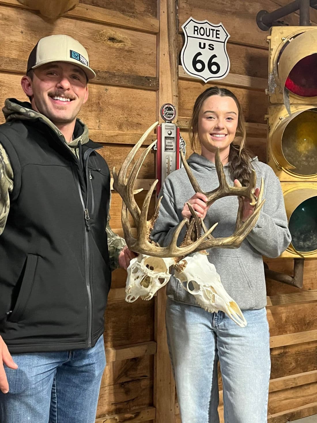 Two customers picking up a wide-racked European mount at the shop