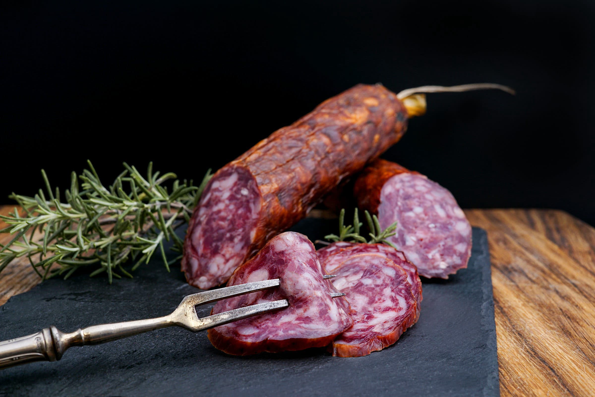 Smoked summer sausage on a cutting board